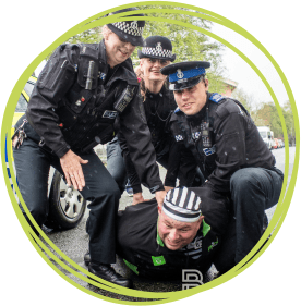 Police officers volunteered their time to 'arrest' local business people